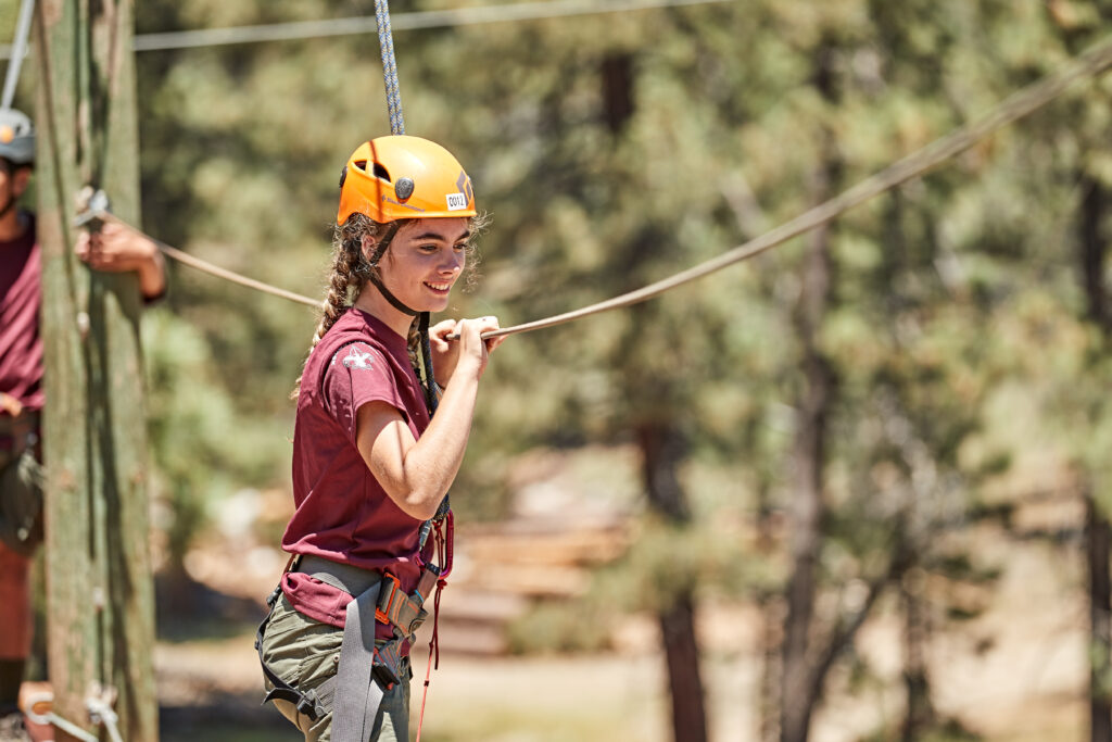 Participating in rope course activities